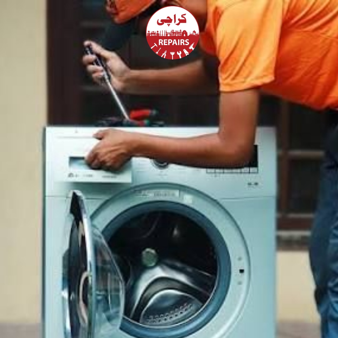 Technician repairing a washing machine motor and appliance circuit board in Karachi