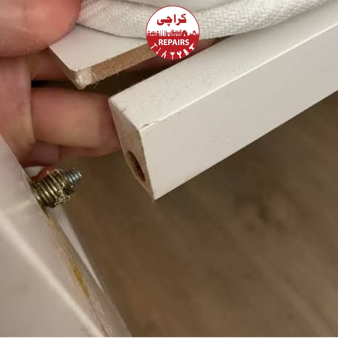 Carpenter restoring an heirloom solid wood baby cot in Karachi
