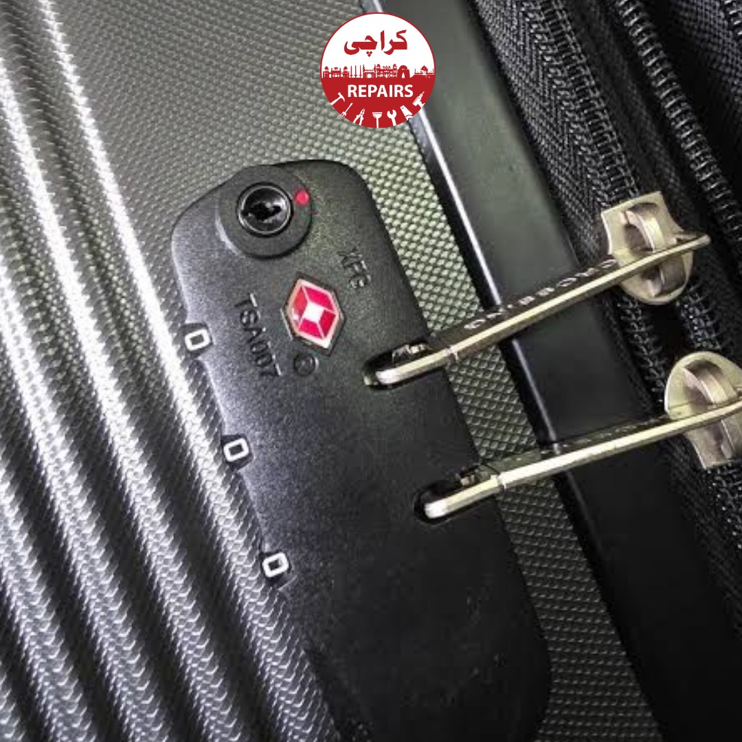 Expert repair technician installing a new TSA-approved combination lock on a suitcase