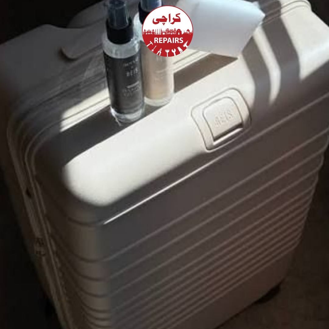 Expert repair technician installing new polyurethane wheels and aluminum handles on Béis luggage