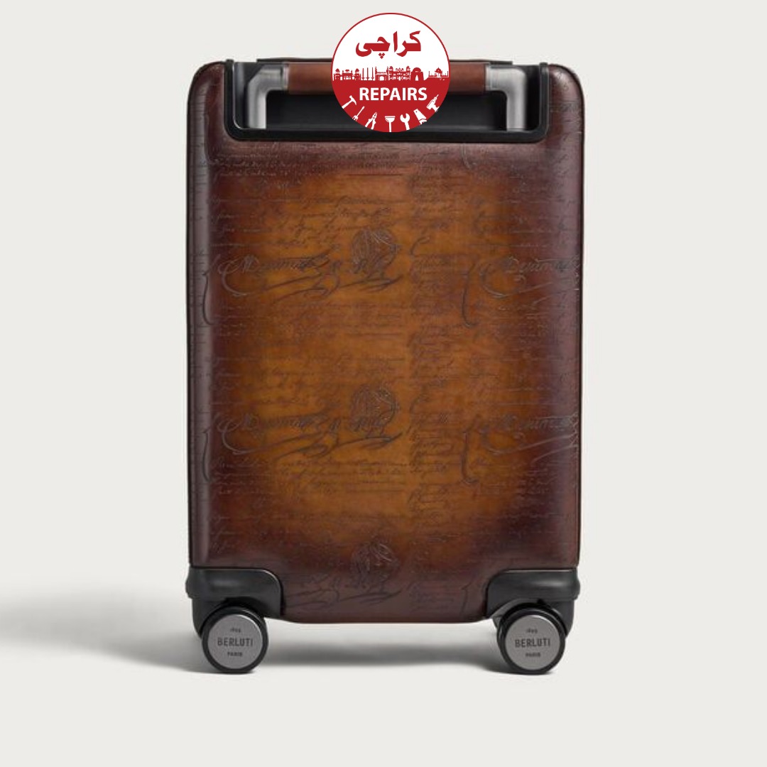 Expert repair technician installing new polyurethane wheels and aluminum handles on Berluti luggage
