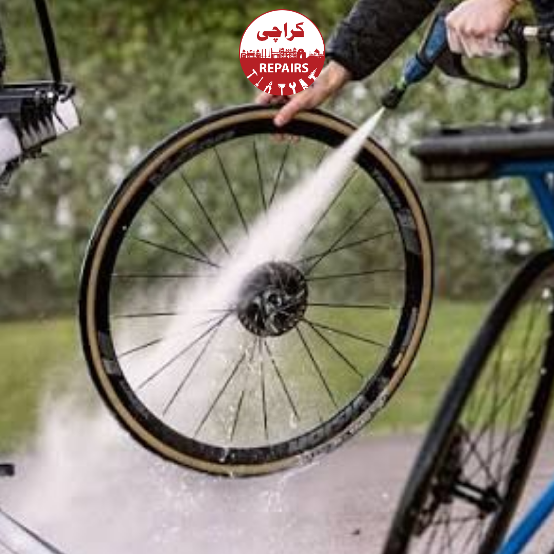 Bike mechanic scrubbing dirty gears and removing grease from a bicycle chain in Karachi