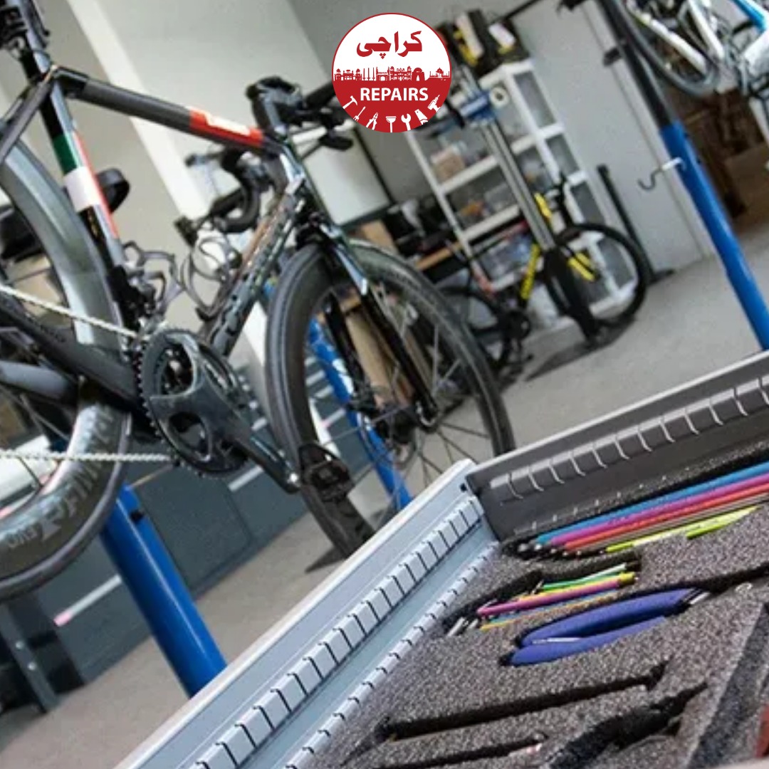 Bike mechanic tightening bolts and fixing brakes during a full bicycle service in Karachi
