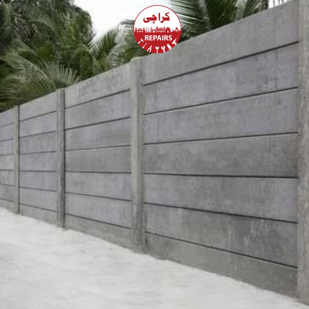 Expert mason aligning solid concrete blocks using precision laser levels for a boundary wall