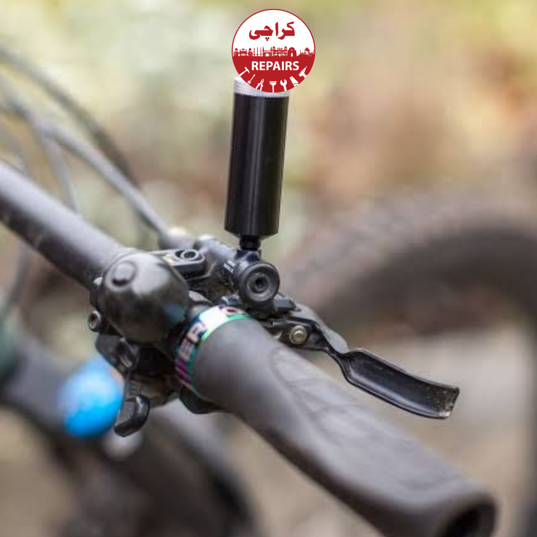 Expert bike mechanic carefully bleeding brake fluid without spilling it on the bike frame