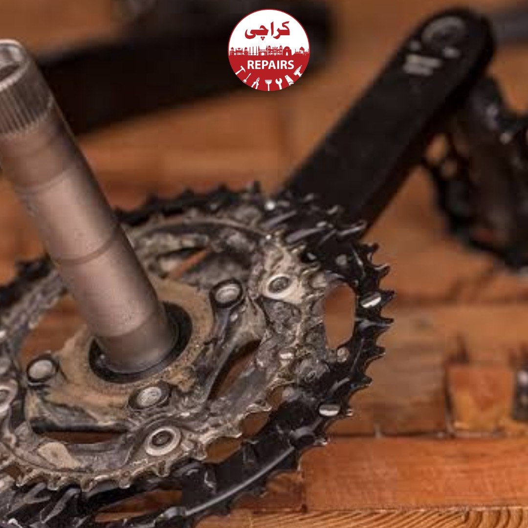 Expert bike mechanic overhauling a Hollowtech II bottom bracket bearing assembly