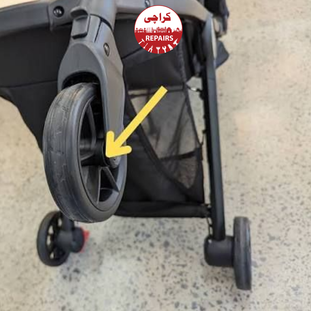 Expert repairman taking apart a stuck stroller hinge to clean the folding mechanism in Karachi
