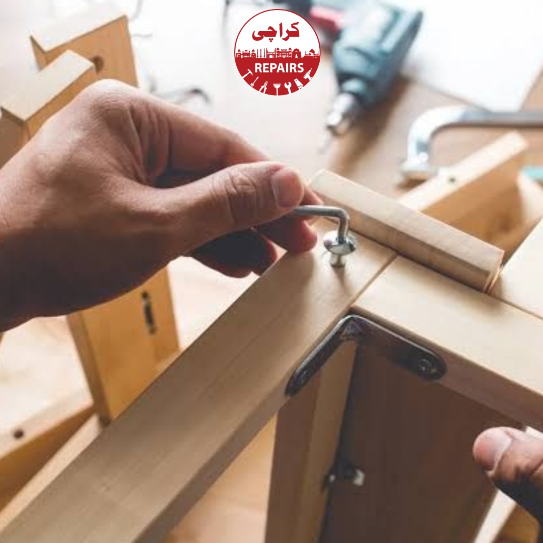 Carpenter meticulously assembling flat-pack wardrobe furniture in Karachi