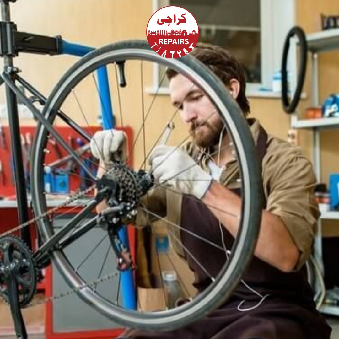 Expert bike mechanic cleaning a dirty bicycle chain and gears before tuning them