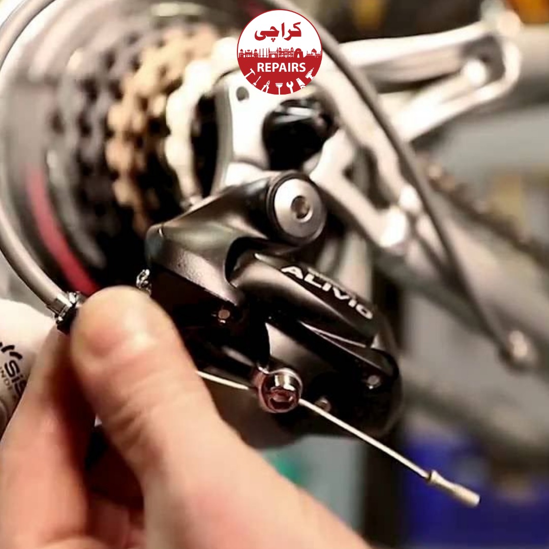 Various types of bicycle gears including Shimano and SRAM derailleurs being tuned in Karachi