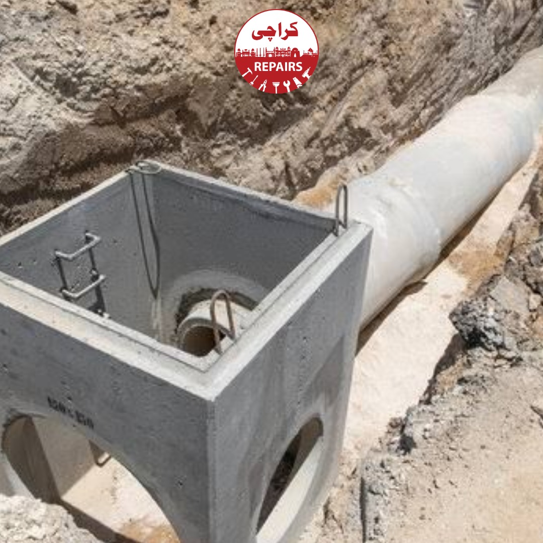 Expert mason aligning pre-cast RCC rings and leveling the base for a deep subterranean inspection chamber