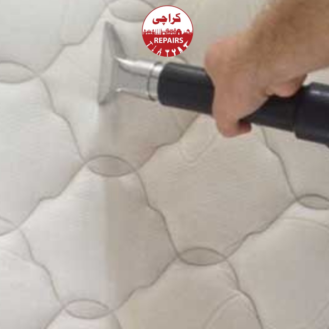 Technician performing deep hot water extraction on a heavily soiled mattress in Karachi