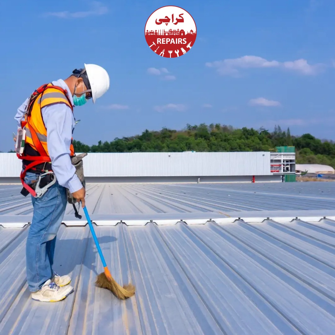Expert roofing worker fixing concrete cracks and doing maintenance on a building roof in Karachi
