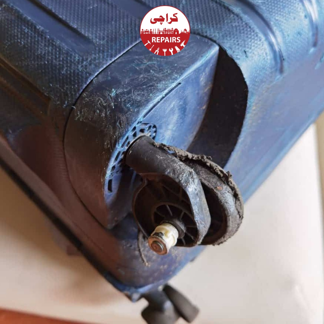 Expert repair technician installing new polyurethane wheels and aluminum handles on Samsonite luggage