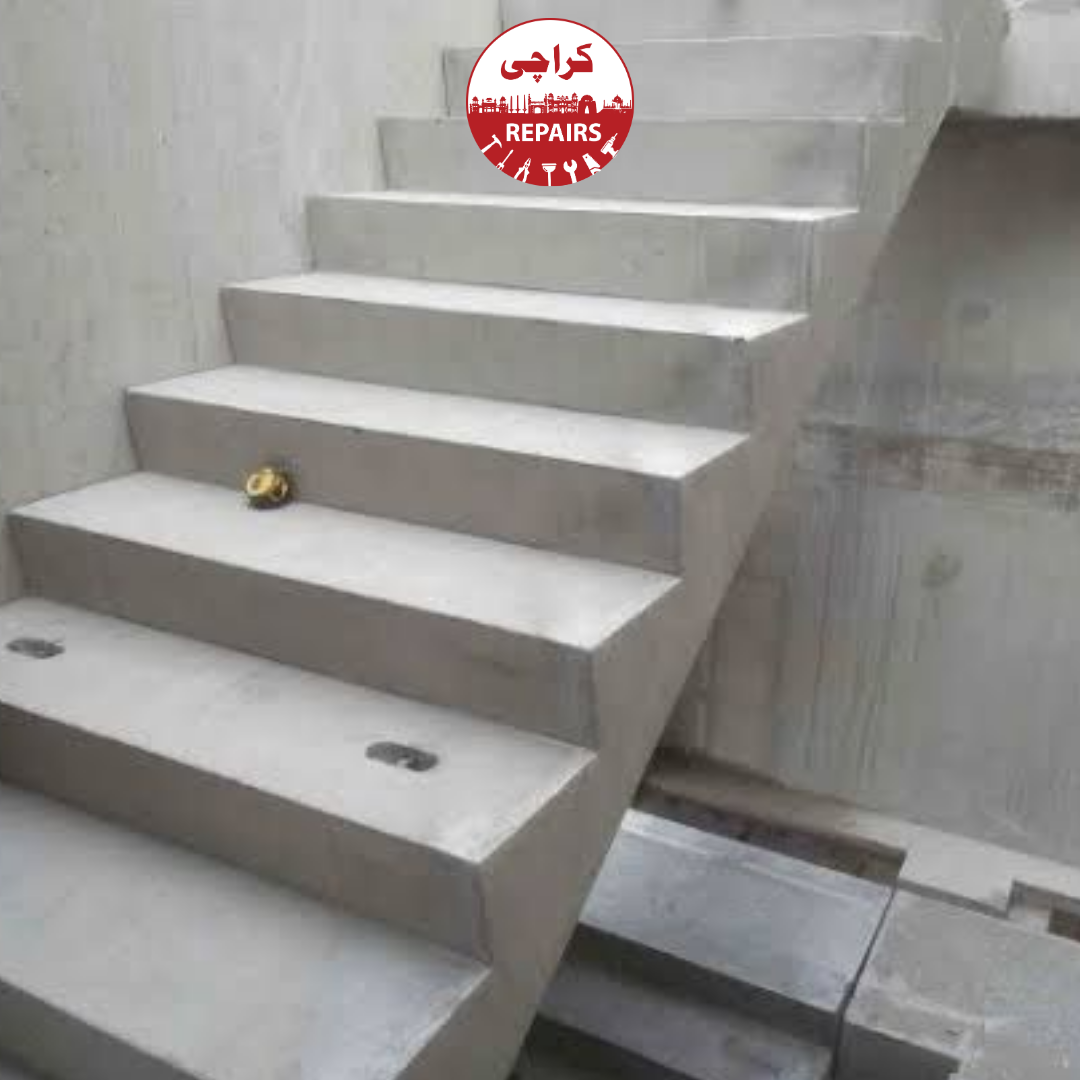 Civil engineers inspecting steel rebar mesh and formwork before RCC staircase casting in Karachi