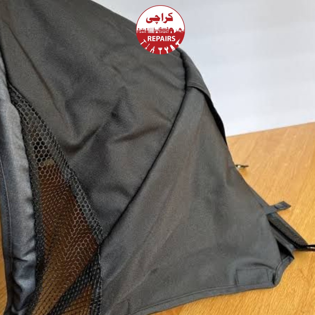 Professional mechanic safely repairing the metal wire inside a stroller hood fabric