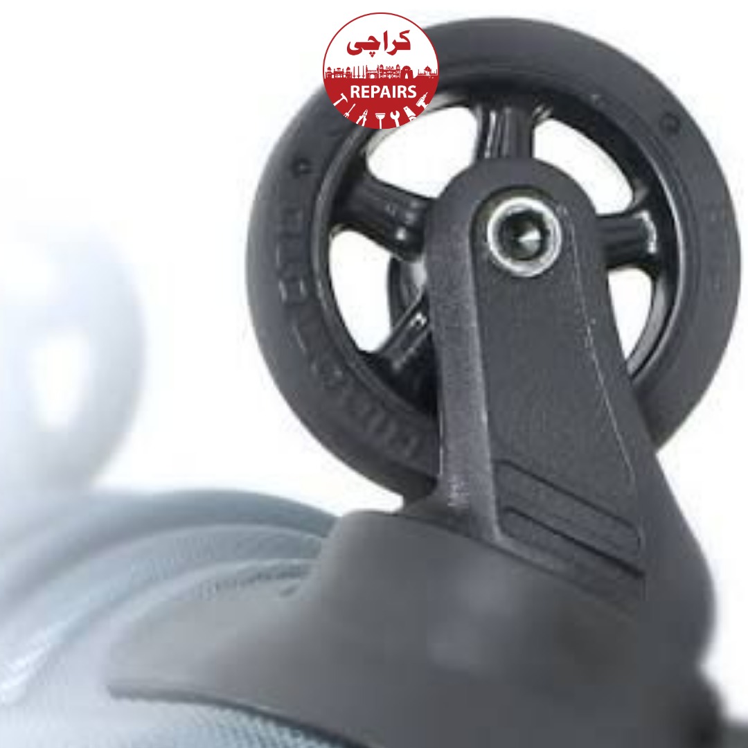 Technician extracting a broken wheel and handle from a travel suitcase in Karachi