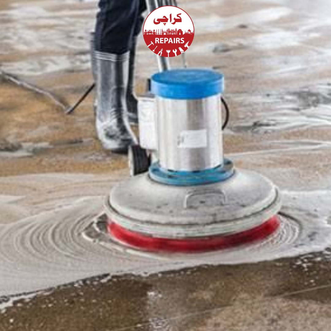 Technician performing high-pressure grout extraction and tile deep cleaning in Karachi