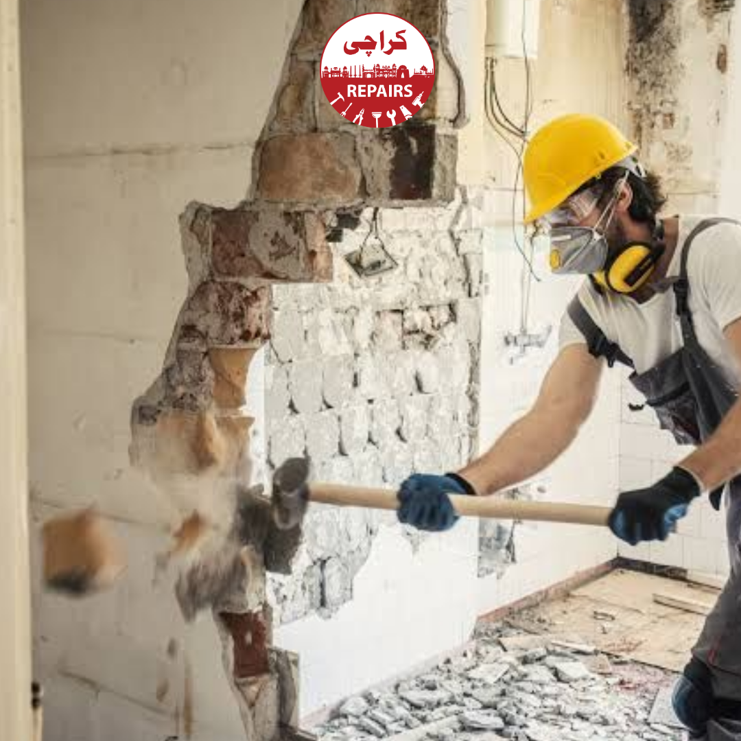 Civil engineers installing heavy steel shoring props prior to structural wall demolition in Karachi