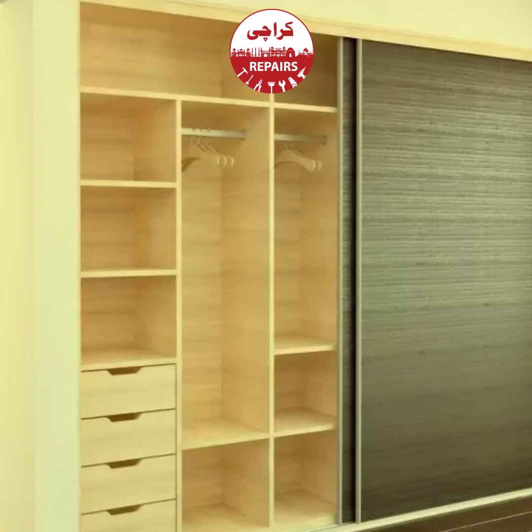 Expert carpenter aligning heavy sliding wardrobe doors and repairing tracks
