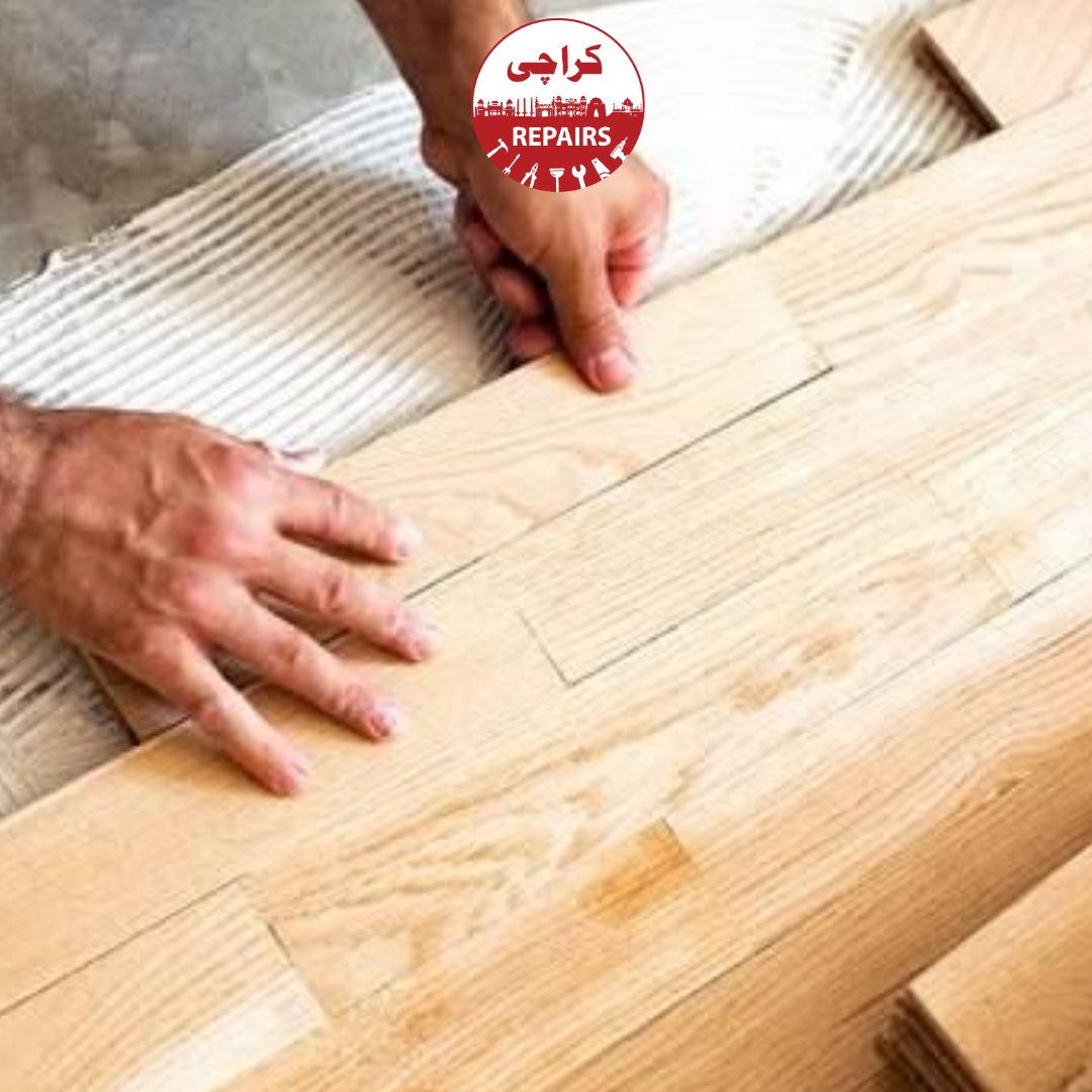 Expert carpenter installing moisture barrier and acoustic underlayment