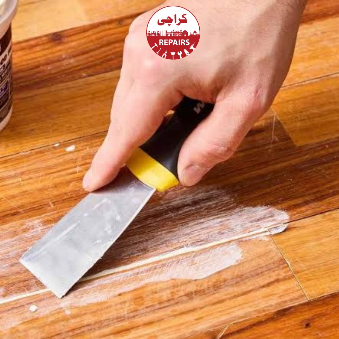 Commercial wooden floor sanding and restoration in a Karachi office