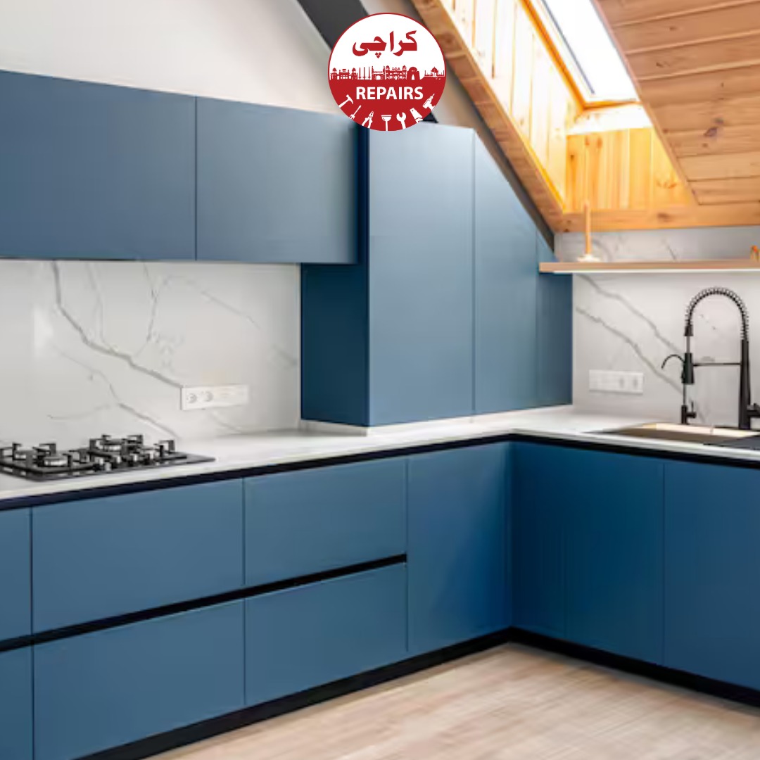 Professional painters applying spray deco paint to kitchen doors while protecting countertops